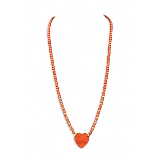 7 - CartierA heart-shaped yellow gold and jasper necklace. The heart-shaped centre set with jasper backg... 