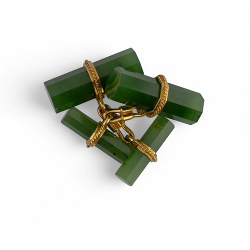 8 - A pair of jade and 18k gold cufflinks by KernThe hexagonal green nephrite bars with gold wirework mo... 