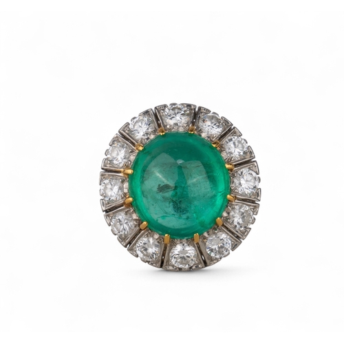 88 - A striking cabochon emerald and diamond cluster ring, circa 1950The central ovoid-shaped cabochon em... 