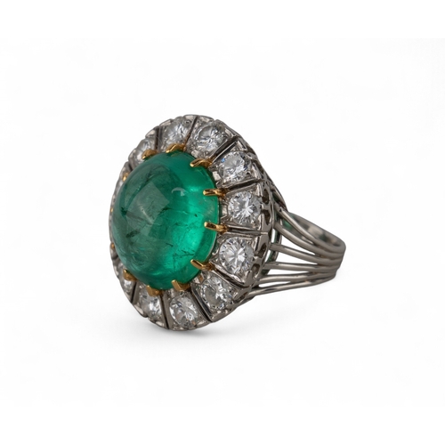88 - A striking cabochon emerald and diamond cluster ring, circa 1950The central ovoid-shaped cabochon em... 