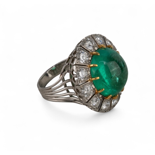 88 - A striking cabochon emerald and diamond cluster ring, circa 1950The central ovoid-shaped cabochon em... 