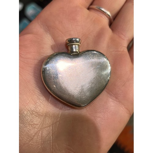 35 - Tiffany & Co, A silver heart-shaped scent bottle and funnelIn its original box and pouch.Approx.... 