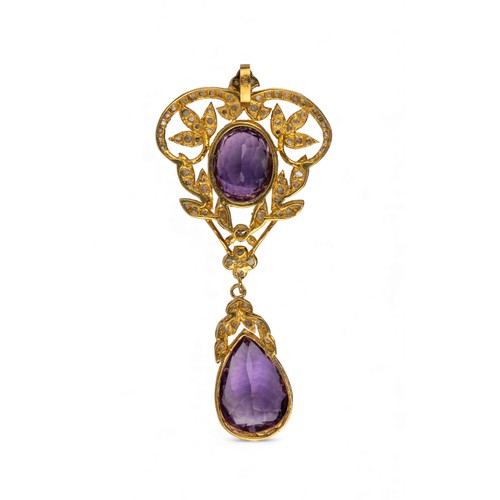 1 - An Edwardian style amethyst and rose-cut diamond pendantThe oval-shaped amethyst top within a scroll... 