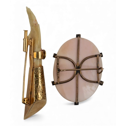 8 - A Victorian conch shell cameo broochMounted with gold and split pearl claws.Together with an antique... 