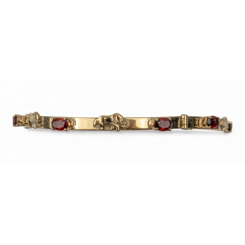 13 - Circa 1970 A 9 carat gold and garnet elephant motif bangleWeight: Approx. 12.88 gramsDimensions: 7.2... 