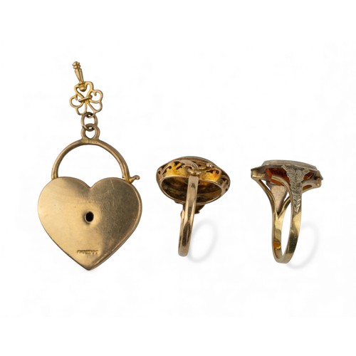 32 - A mixed lot of jewelleryTo include:[a] A 9 ct gold heart-shaped locket[b] A jade and 14 ct gold ring... 
