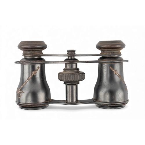 36 - A pair of Edwardian gunmetal and diamond-set opera glassesThe small pair of opera glasses with rose-... 