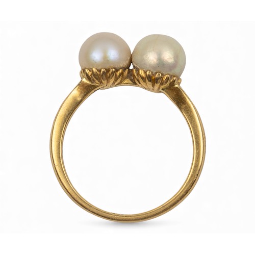 33 - Circa 1920A two stone pearl and 18 carat gold dress ringThe two pearls measuring approximately 6.8 m... 