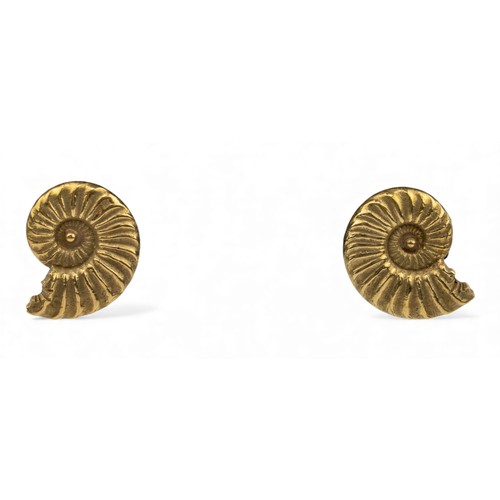 58 - Circa 1970A pair of yellow metal ammonite fossil ear clipsUnmarked, but test chemically as 14 ct or ... 