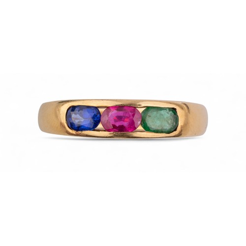 55 - Circa 1980sAn 18k sapphire, ruby and emerald yellow gold band ringTotal weight: Approx. 9.56 g.... 