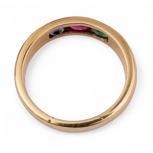 55 - Circa 1980sAn 18k sapphire, ruby and emerald yellow gold band ringTotal weight: Approx. 9.56 g.... 