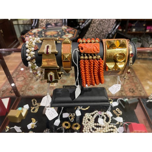 45 - Circa 1980A gold and multi-gem set braceletSet with various melon fluted gems, and a fringe of small... 