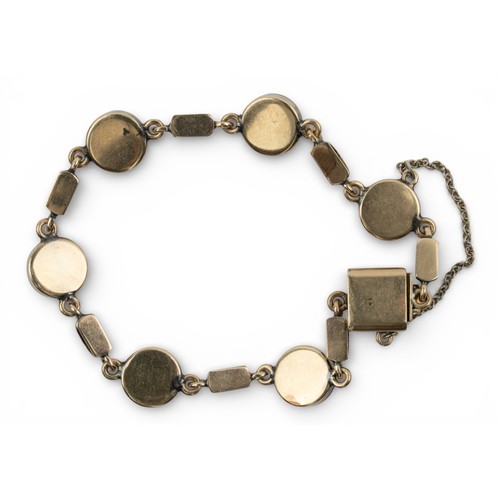 3 - AntiqueA 9k gold and cabochon red paste bracelet. Composed of seven circular rub-over mounted stones... 