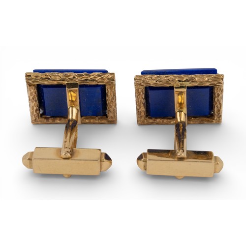 9 - 1970s, A pair of lapis lazuli and 18k yellow gold cufflinksThe bright blue lapis lazuli tablets set ... 