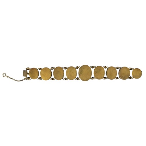 23 - A late Victorian banded agate and gilt metal braceletComposed of nine graduated size banded agates, ... 