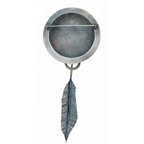 27 - An abstract silver and gold broochThe planished sphere with a gold terminal suspending a silver and ... 