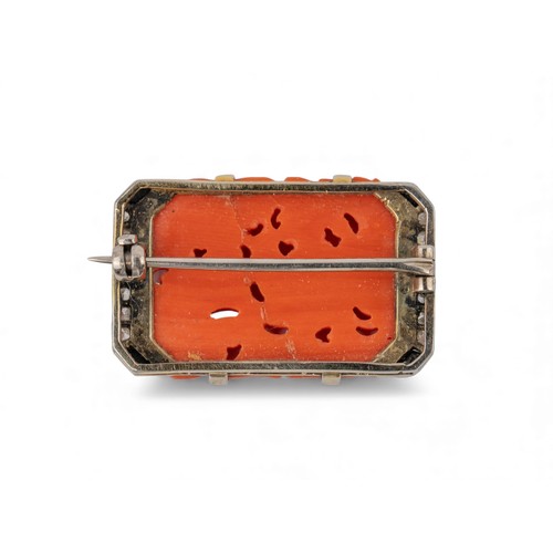 25 - An Art Deco coral, diamond, and black onyx brooch, French, circa 1920Set to the centre with a pierce... 