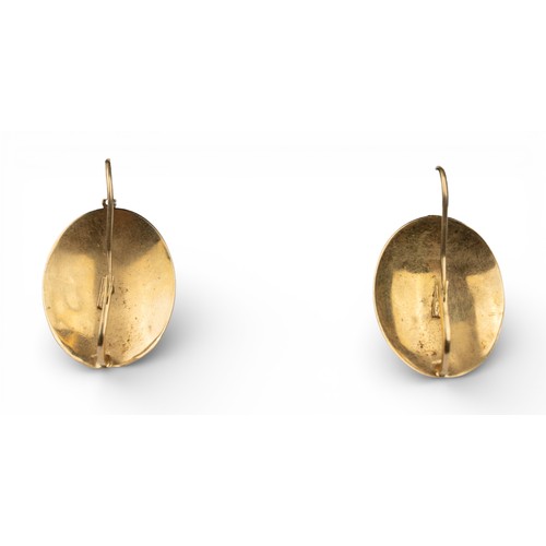 41 - AntiqueA pair of red coral and 18k gold oval pendant earrings. The oval red coral cabochons with rub... 