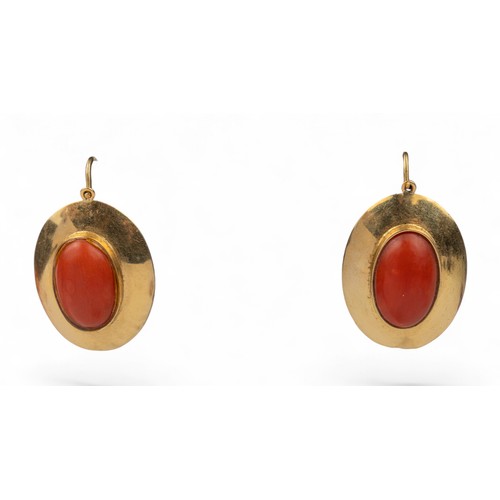 41 - AntiqueA pair of red coral and 18k gold oval pendant earrings. The oval red coral cabochons with rub... 