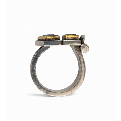 50 - Barbara BertagnolliAn abstract silver gold and gem-set dress ring. Set with a rectangular-cut collet... 