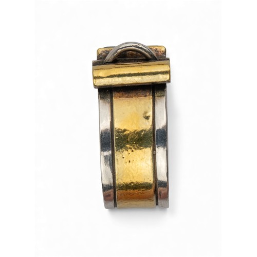 50 - Barbara BertagnolliAn abstract silver gold and gem-set dress ring. Set with a rectangular-cut collet... 