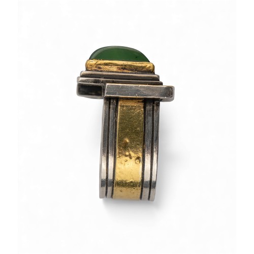 48 - Barbara BertagnolliA gold and silver gem-set dress ring. The abstract design set with a cabochon gre... 