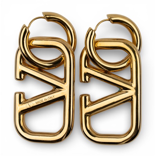 53 - A pair of Valentino gilt-metal pendant earrings and silver and gold-coloured metal bangles