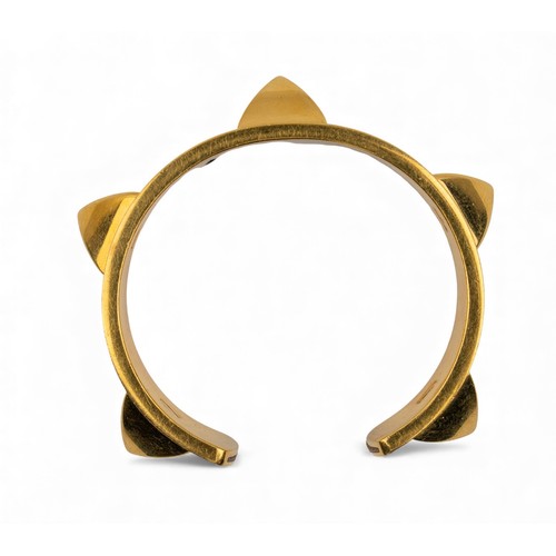 49 - Hermès, ParisA leather and gilt metal bangle, circa 1980Signed.
