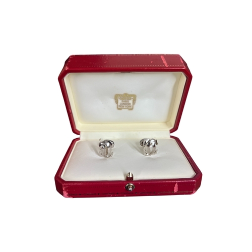 21A - CartierA pair of 18 carat white gold C de Cartier cufflinksIn original Cartier box, with certificate... 