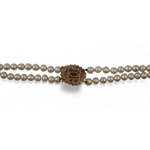 24A - A two-row cultured pearl necklace with citrine and pearl claspThe two rows of slightly baroque unifo... 
