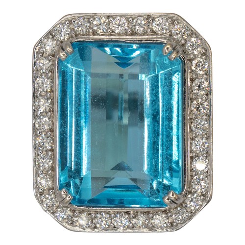 An attractive blue topaz and diamond ring, circa 2000The rectangular ...