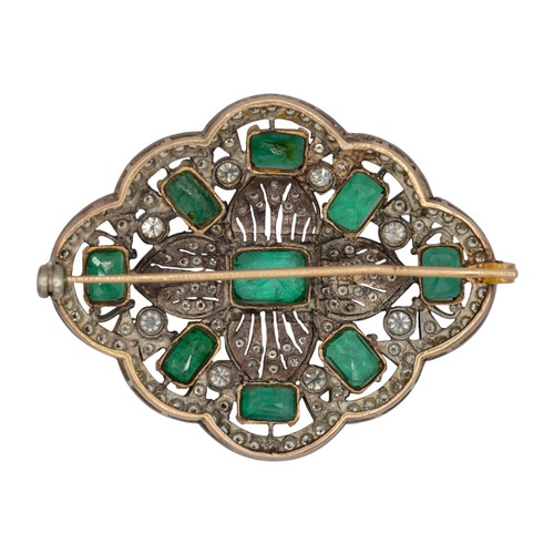11A - A fine emerald and diamond brooch, circa 1960The scalloped brooch set with nine rectangular-cut emer... 