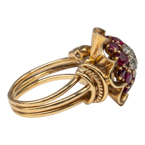 19 - A ruby and diamond cluster ring, circa 1940sThe central seven-stone brilliant-cut diamond cluster, w... 