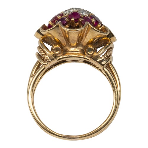 19 - A ruby and diamond cluster ring, circa 1940sThe central seven-stone brilliant-cut diamond cluster, w... 