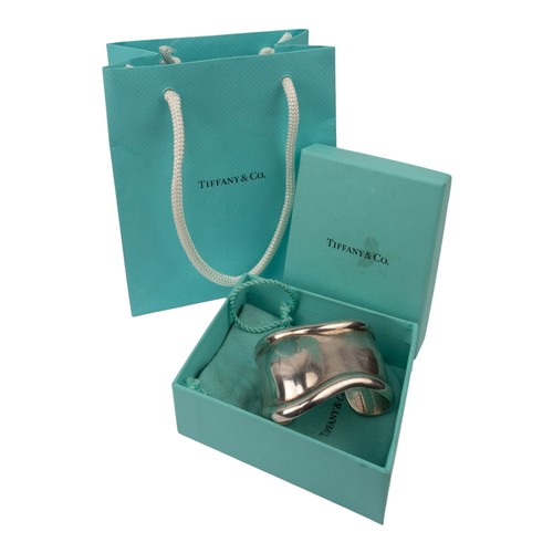 26 - Elsa Peretti for Tiffany, A 1978 Small Bone sterling silver cuffSigned to the insideIn its original ... 