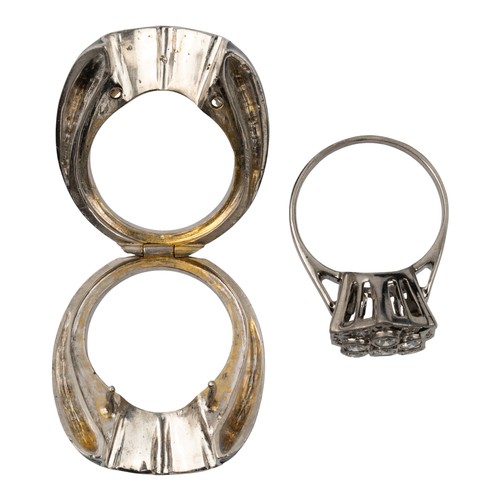40 - An unusual diamond-set dress ring, circa 1960/70Encased in a black enamel and silver metal outer fra... 
