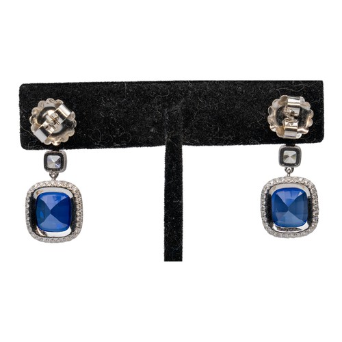 57 - A pair of sapphire and diamond pendant earringsEach cushion-shaped sapphire claw-set within a pave-s... 