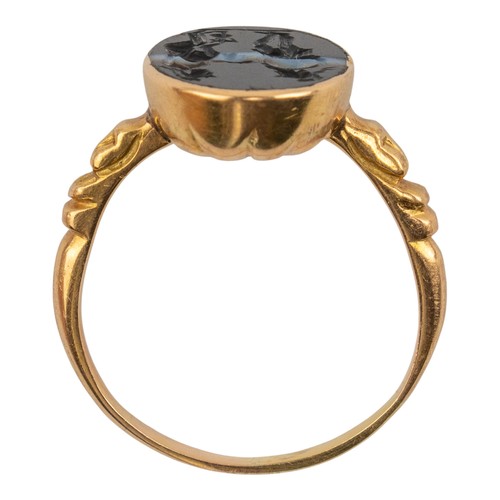 62 - Roman, 1st-2nd century BCA banded agate intaglio depicting the sons of ZeusSet in a later gold mount... 