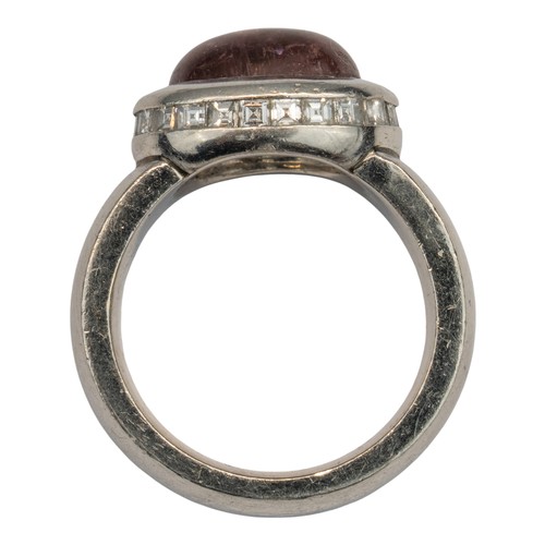 58 - H&uuml;lse, A platinum, diamond and tourmaline dress ringThe cabochon red tourmaline with a surround... 