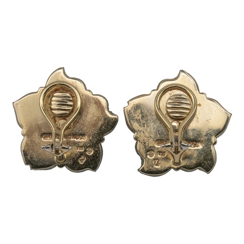 65 - Seaman Schepps, A pair of carved crystal, diamond and aquamarine ear clipsDesigned as a five-petal f... 