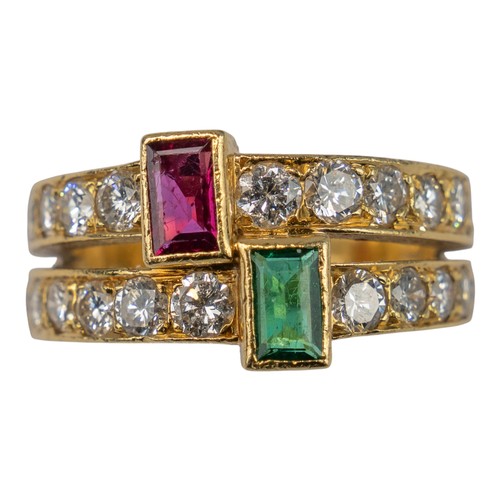 73 - A ruby, emerald and diamond two-band ring, circa 1980Set to the centre with a square-cut ruby and a ... 