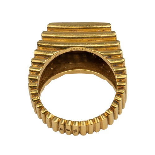 69 - Piaget, 1970sAn 18k gold, diamond and malachite gentleman's dress ring. The heavy yellow gold ribbed... 