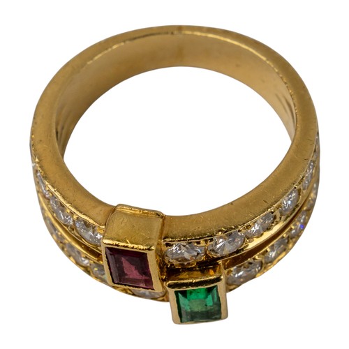 73 - A ruby, emerald and diamond two-band ring, circa 1980Set to the centre with a square-cut ruby and a ... 