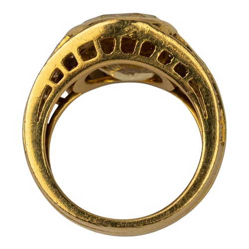 74 - A yellow sapphire, ruby and diamond dress ring, circa 1980The oval-shaped mixed-cut yellow sapphire ... 