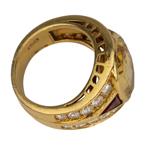 74 - A yellow sapphire, ruby and diamond dress ring, circa 1980The oval-shaped mixed-cut yellow sapphire ... 