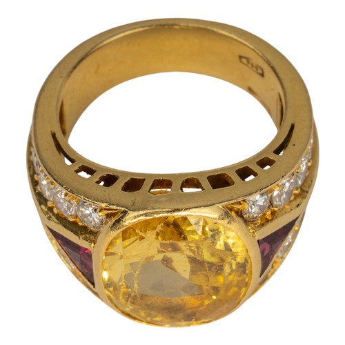 74 - A yellow sapphire, ruby and diamond dress ring, circa 1980The oval-shaped mixed-cut yellow sapphire ... 