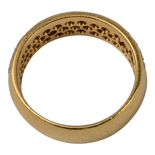 77 - A diamond, ruby, emerald and sapphire pave-set band ring, circa 1980The top designed as five small f... 