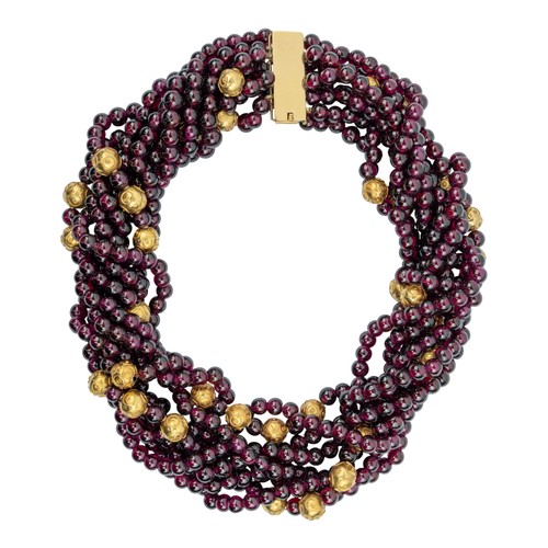 78 - An eight-strand garnet and yellow gold bead necklaceThe almandine garnets strung at intervals with s... 