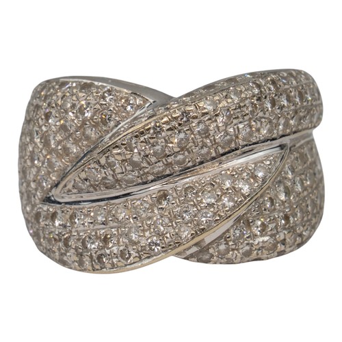 99 - An 18k white gold and diamond dress ringThe pave-set ring set throughout with brilliant-cut diamonds... 