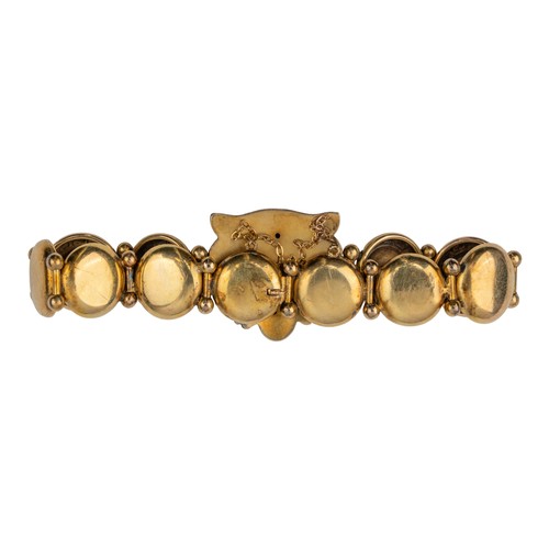 94 - Early 20th centuryA gold and diamond lion's head bracelet, circa 1900. The front set with a lion's m... 